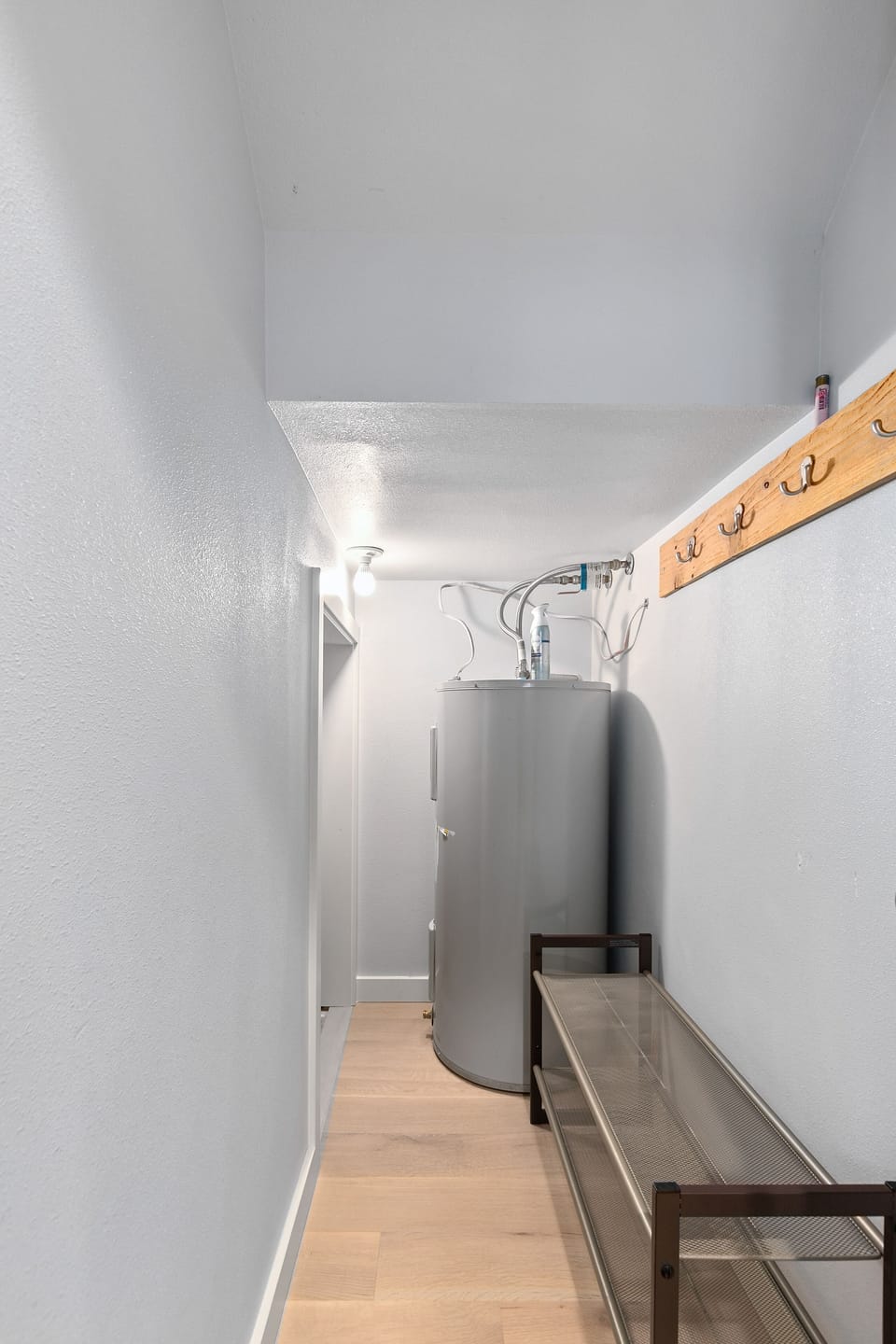 Coat and shoe closet off entry.