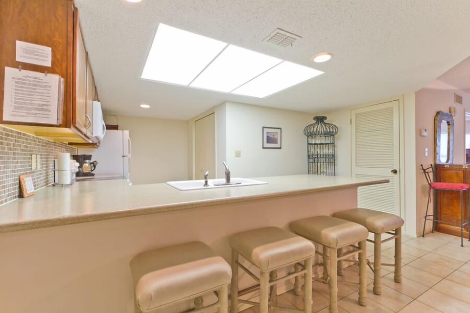 This kitchen bar offers extra seating for guests to enjoy