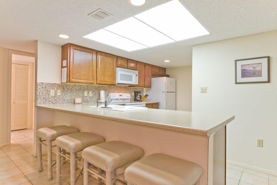 This kitchen bar offers extra seating for guests to enjoy