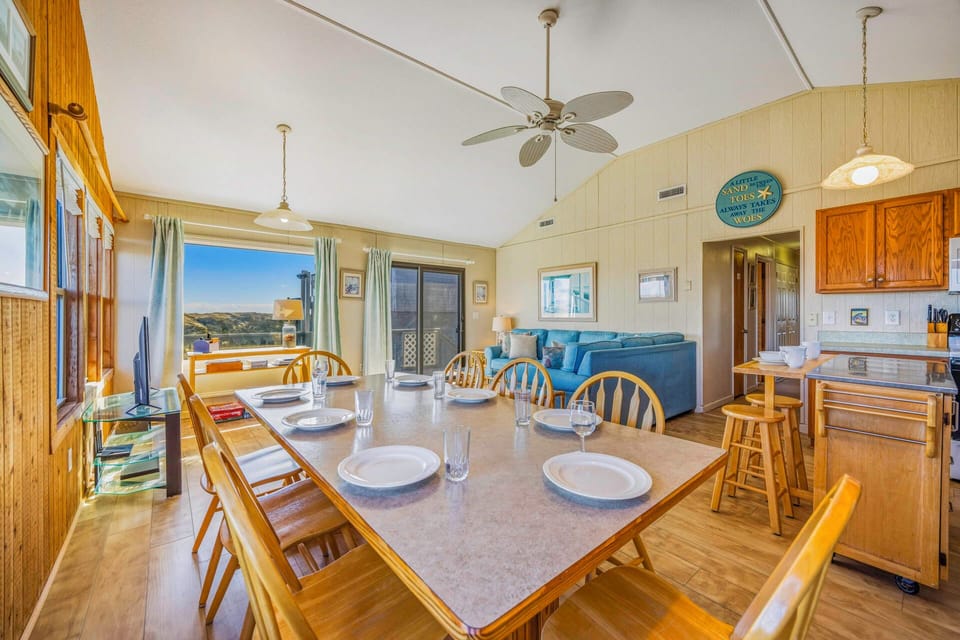 Gather around your spacious dining table for memorable meals while enjoying natural light and coastal views from every window.