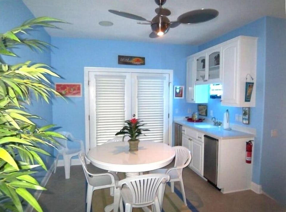 Sunset lounge and wetbar; doors open to a great balcony and views of the island