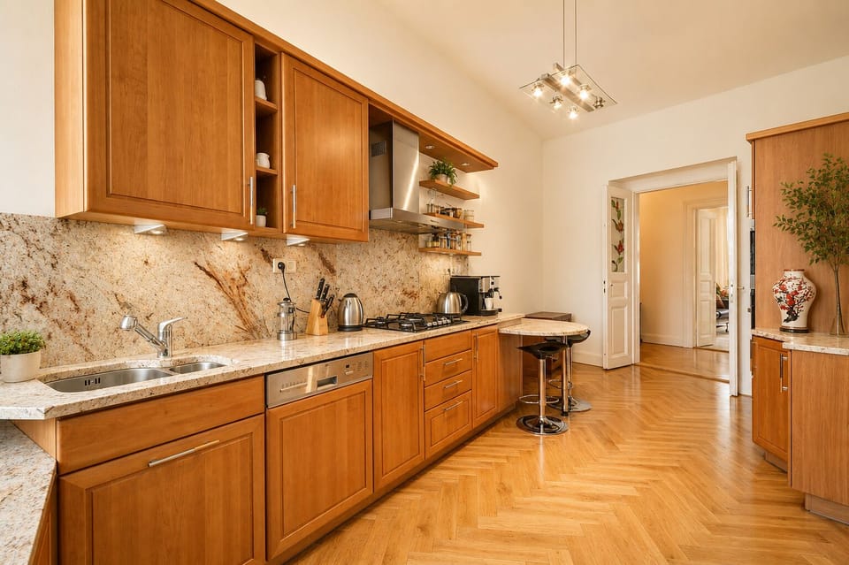 Spacious fully equipped kitchen with dishwasher, gas stove, and breakfast bar. 