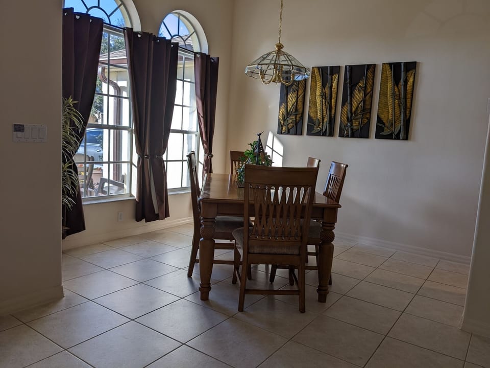 The spacious dining room provides a warm family dining retreat