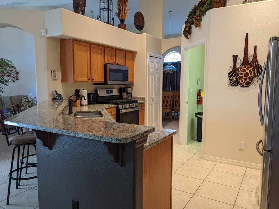 Spacious kitchen with bar counter provides a family gathering place

