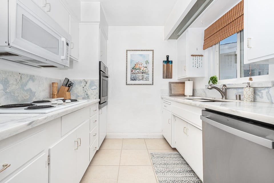The kitchen comes stocked with dishes, utensils, cookware, bakeware, and all large and small appliances.
                