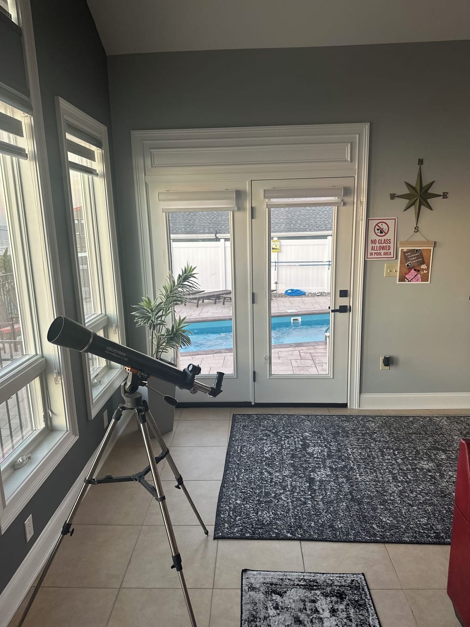 Family room overlooking the pool, beach and water with 14 windows in the room