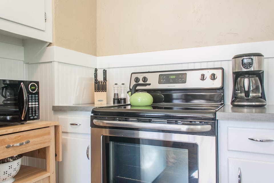 Modern appliances, oils, spices make this kitchen a joy to use.
