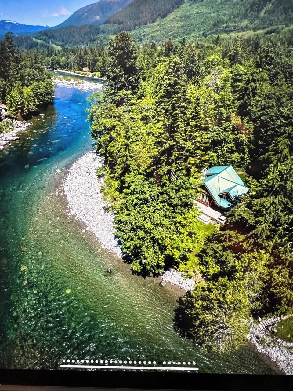The cabin reveals its quiet seclusion and intimate connection to the river.
