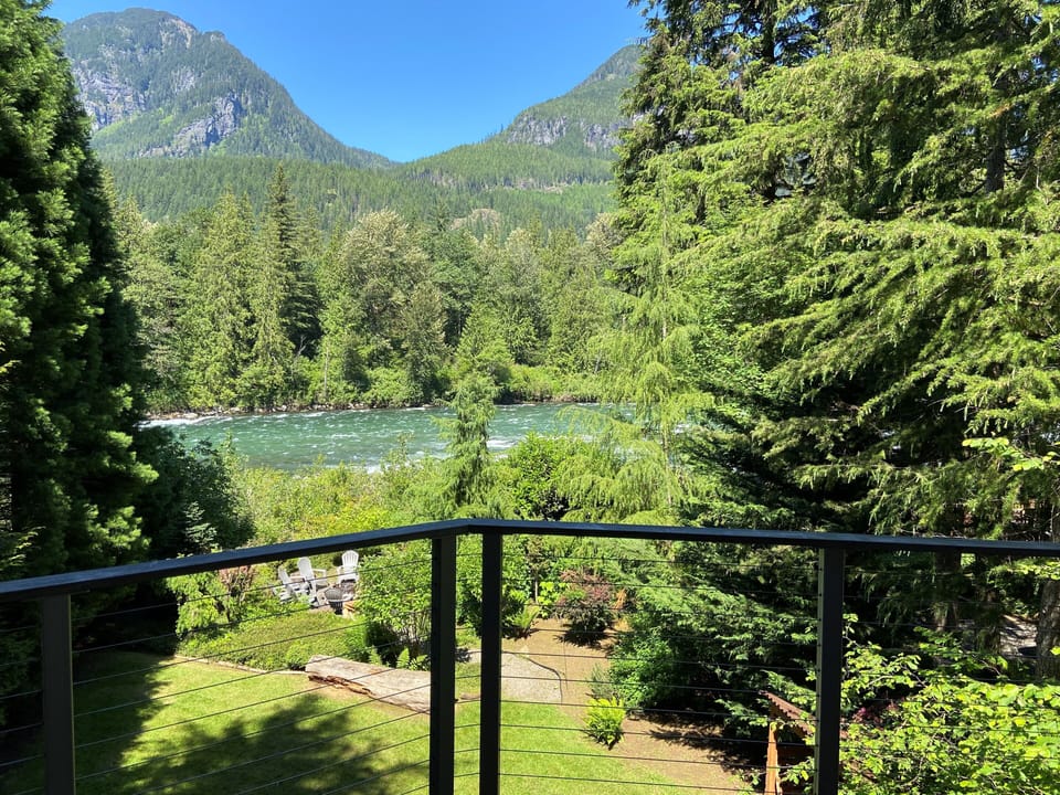 View of Skykomish River and Cascade Mountains from deck