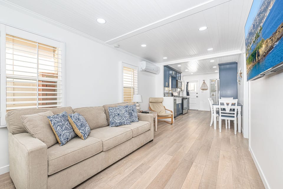 The living area opens up to the kitchen, making meal prep a social affair!
                