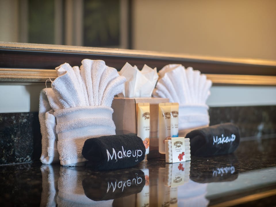 Luxury meets comfort with premium bathroom amenities, soft towels, and Hawaiian Tropic products, ensuring a pampered experience during your stay in Maui.