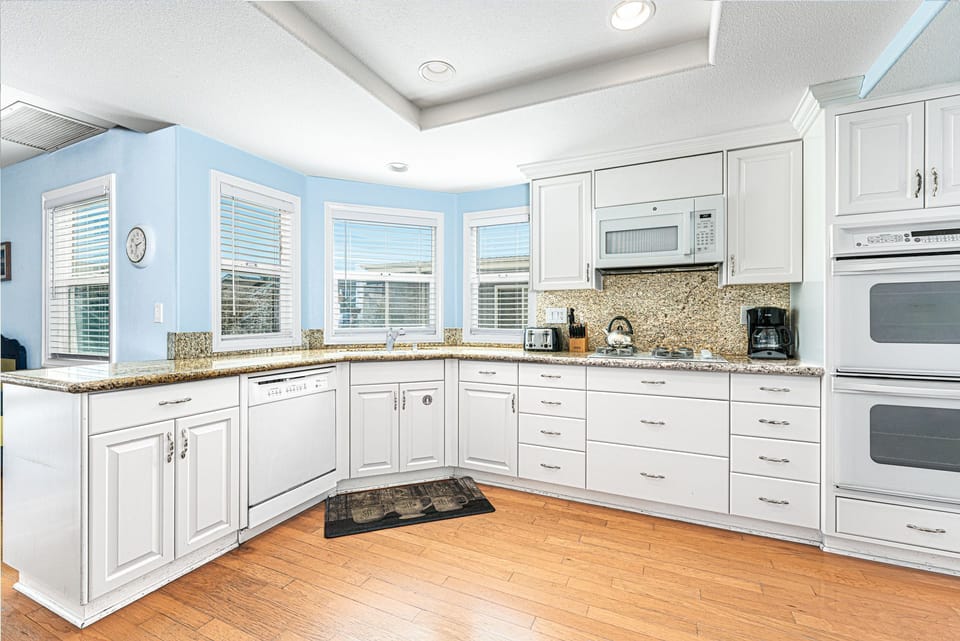 Kitchen comes stocked with dishes, utensils, cookware, bakeware, and all major and small appliances.
                