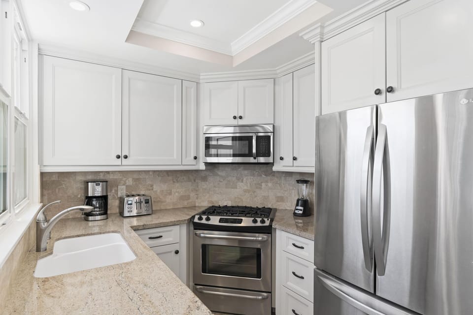 Upgraded kitchen is fully-stocked with dishes, cooking, baking and meal prep gear. All standard large and small appliances included. See listing description.
                