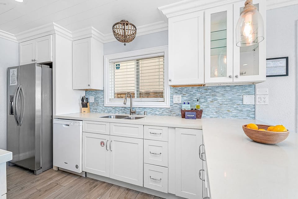 Enjoy a bright coastal kitchen with modern finishes and plenty of space to prep meals after a day at the beach.
                