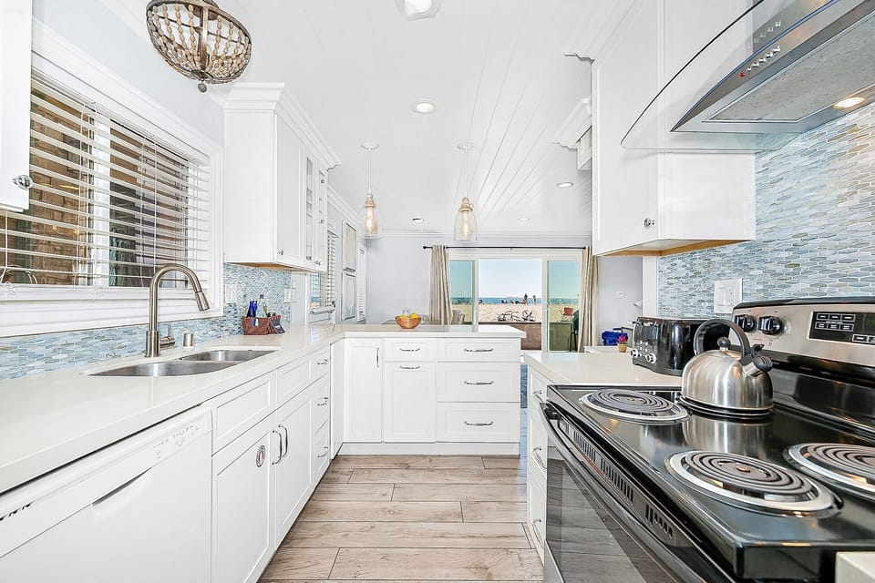 Cook with an ocean view in this beautifully updated kitchen overlooking the beach.
                