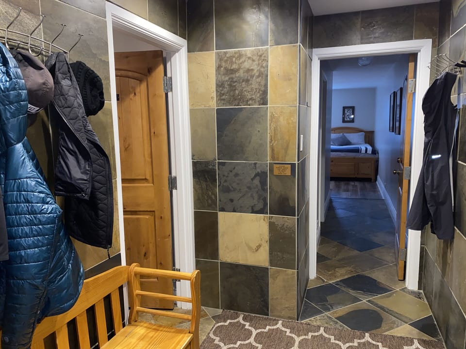 Entry with boot bench, coat hooks,  shelving for goggles/helmets, ski racks