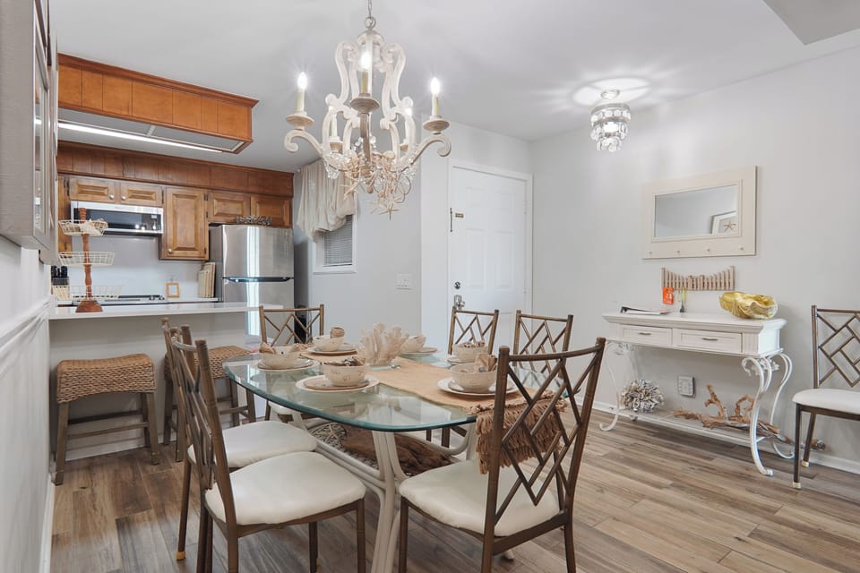 Porcelain wood plank flooring, Quartz counters backsplash high end appliances