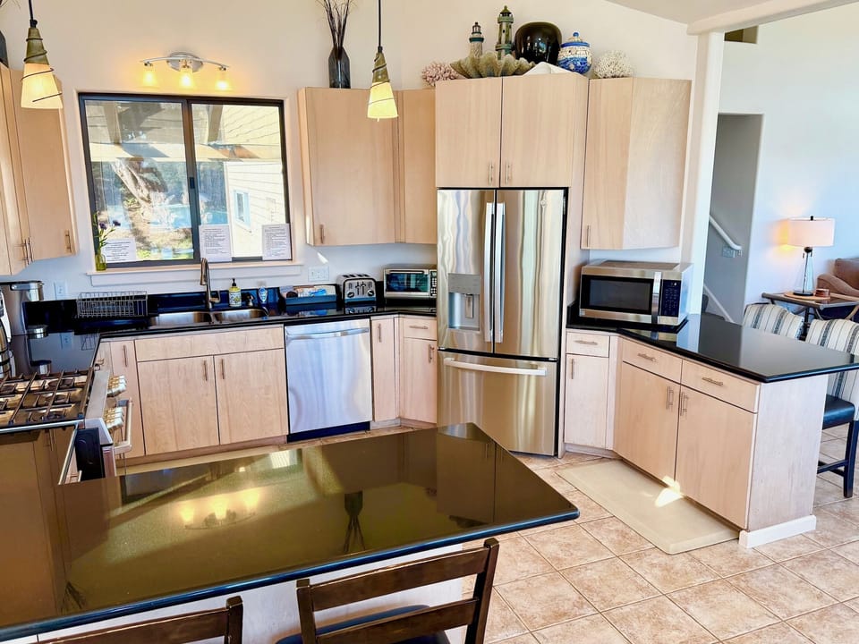 Well equipped kitchen has all utensils, dinnerware and most small appliances, 