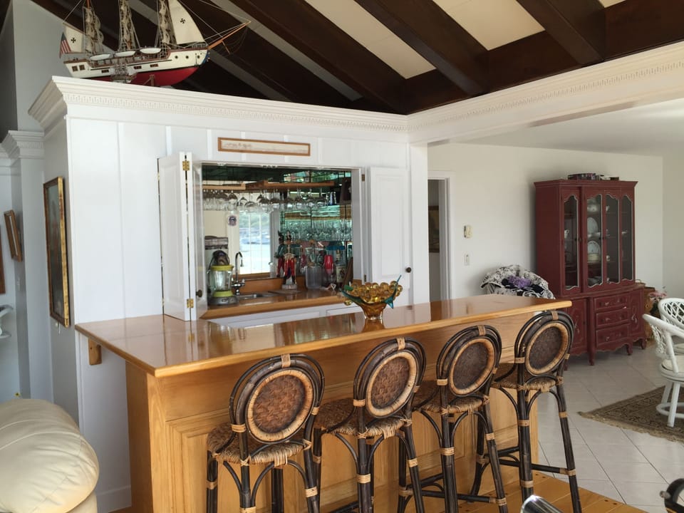 Wet Bar in living room with seating 4 and great waterviews!  Margarita Blender