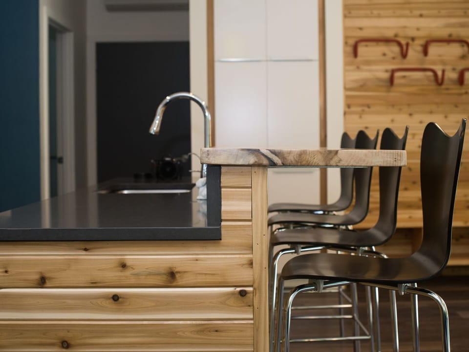 Belly up at the live edge bar for more seating and fun!