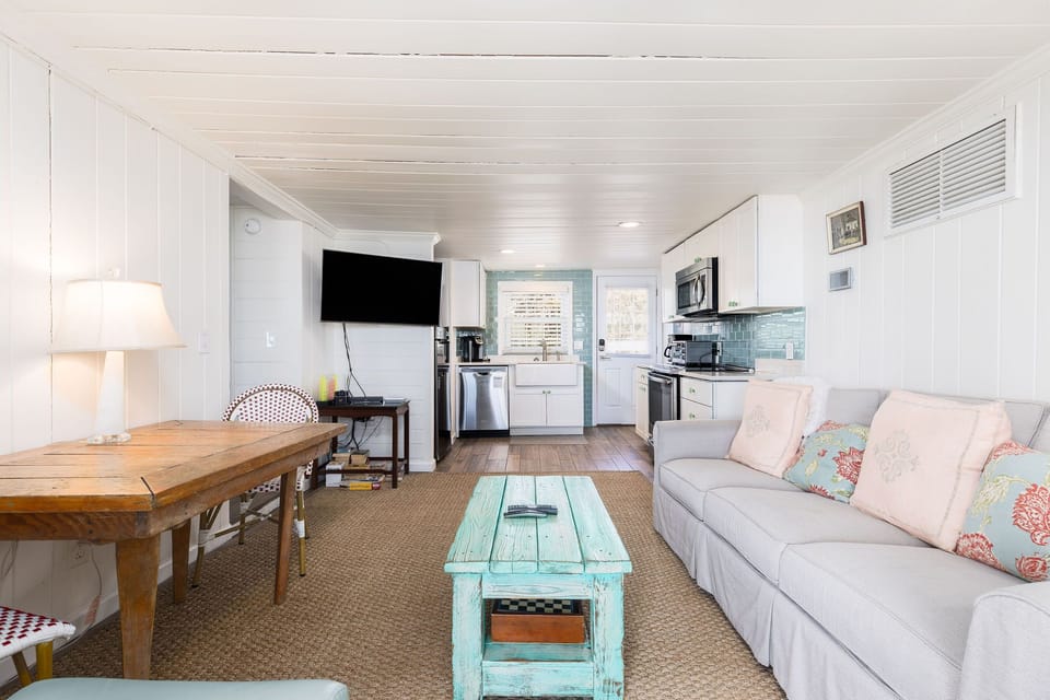 Relaxing Living Area with smart TV and comfortable seating — steps from the beach