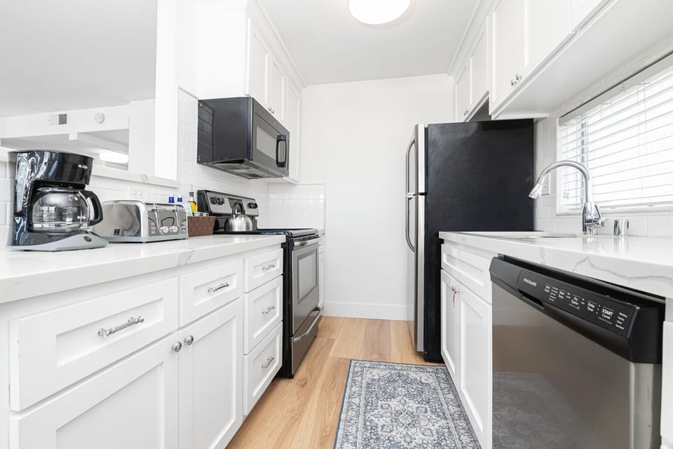 The kitchen comes stocked with dishes, utensils, cookware, bakeware, and all major and small appliances.
                