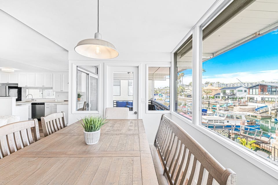 Enjoy meals with a view in this light-filled dining area overlooking the bay.
                