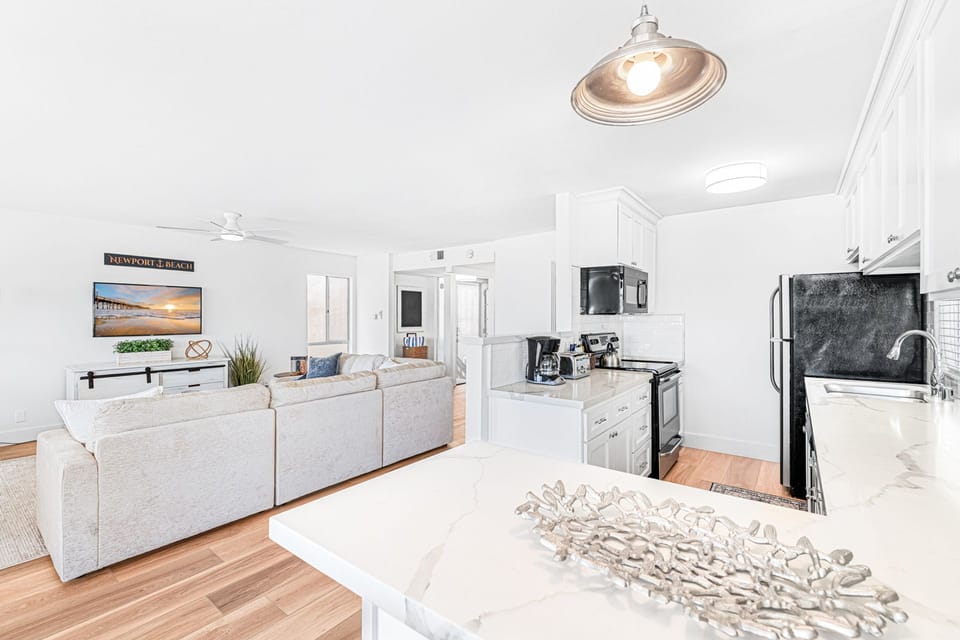 The kitchen counter includes barstool seating, making meal prep a social affair!
                