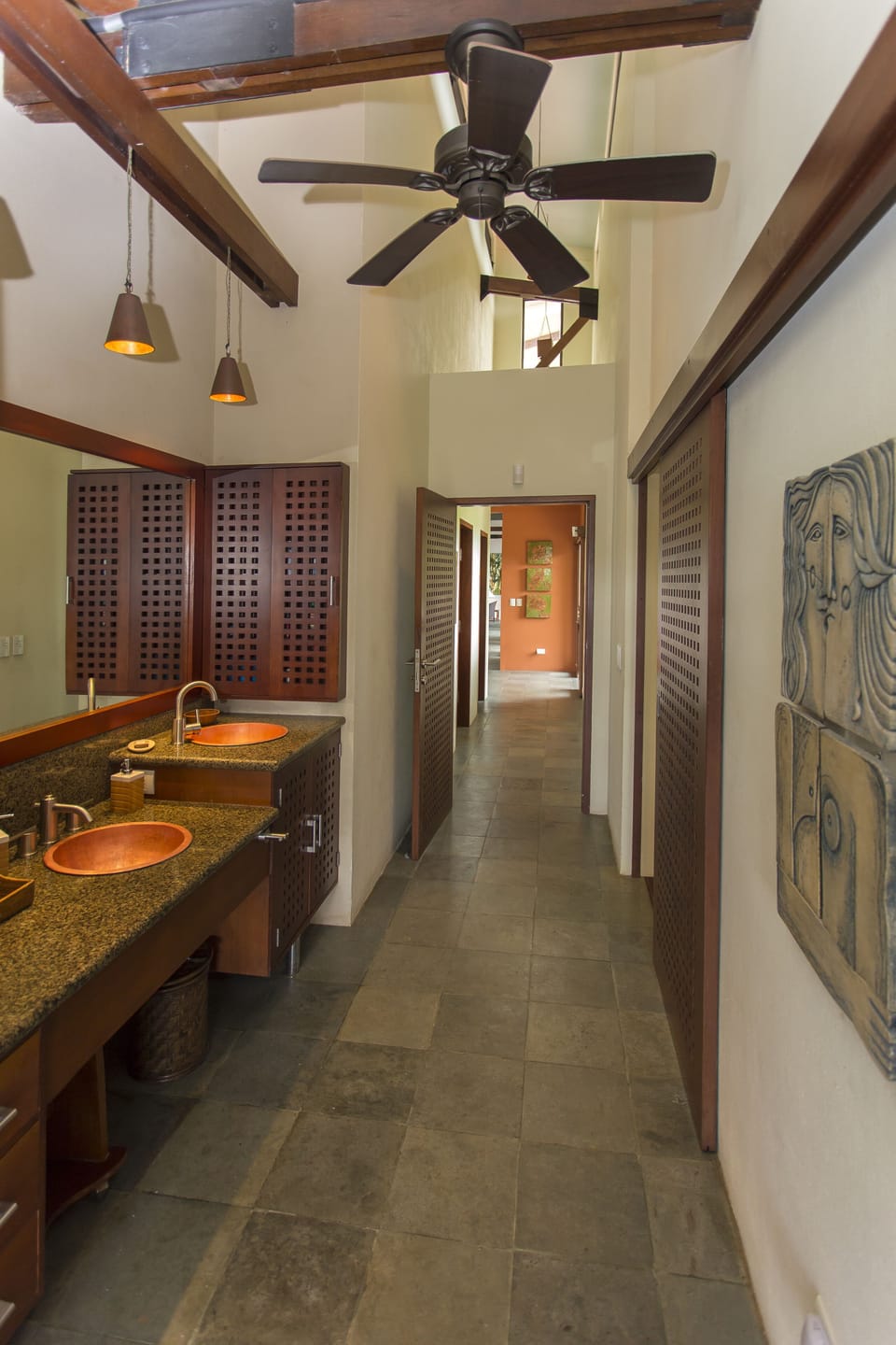 To the right off the entry,  past a queen bedroom and bath to the master suite.