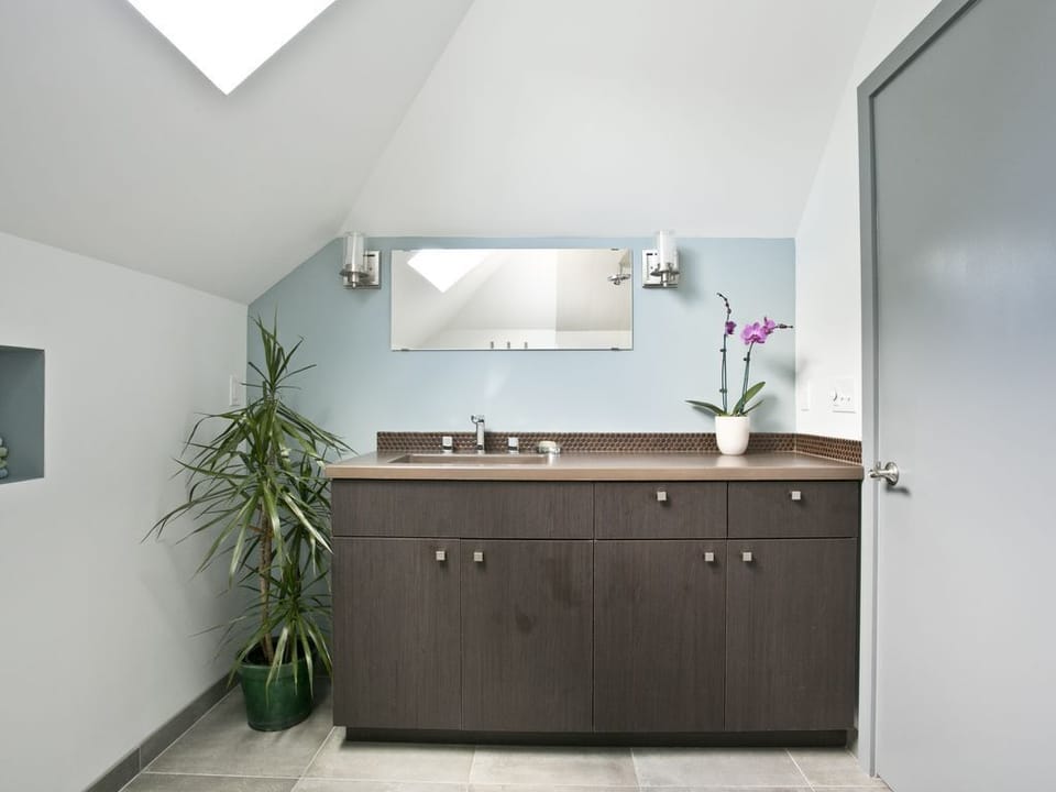 Full large bathroom on the second floor with walk in tiled shower.