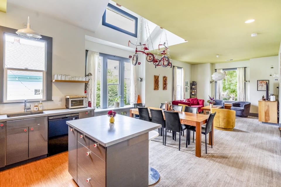 Living, dining &amp; kitchen in the upper part of the duplex. Room for all to hang out.