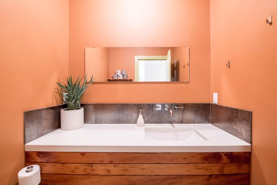 A half bath in the lower part of the duplex.