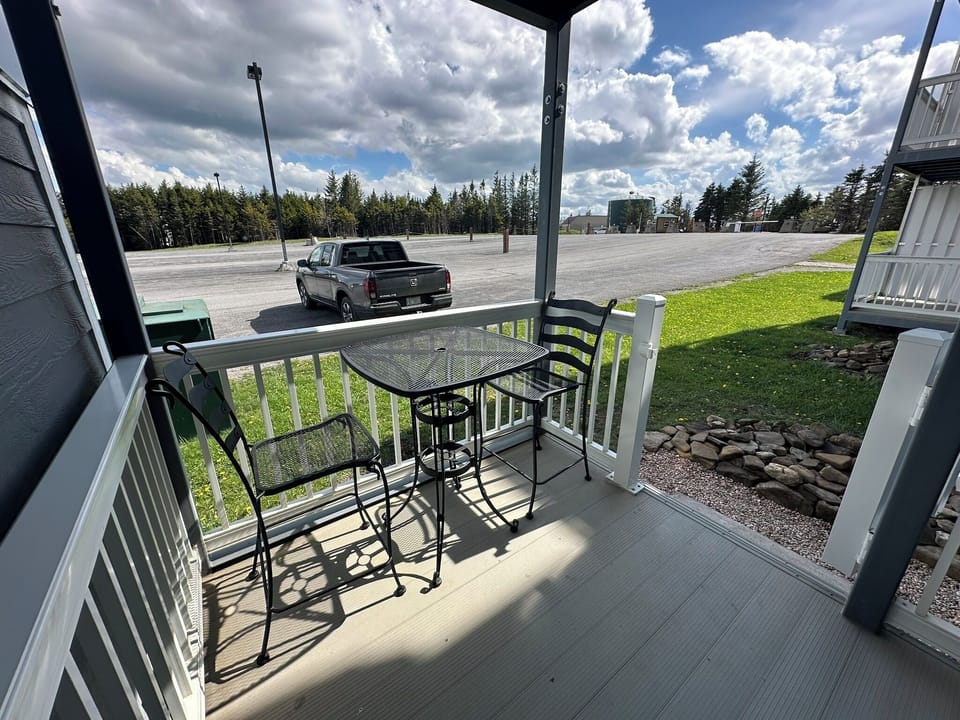 View from the deck.  Furniture for outdoor eating or relaxing.