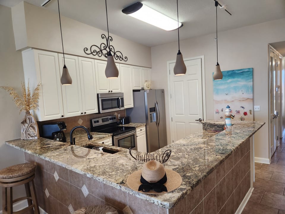 Fully equipped kitchen.  Enjoy your beach view while cooking.