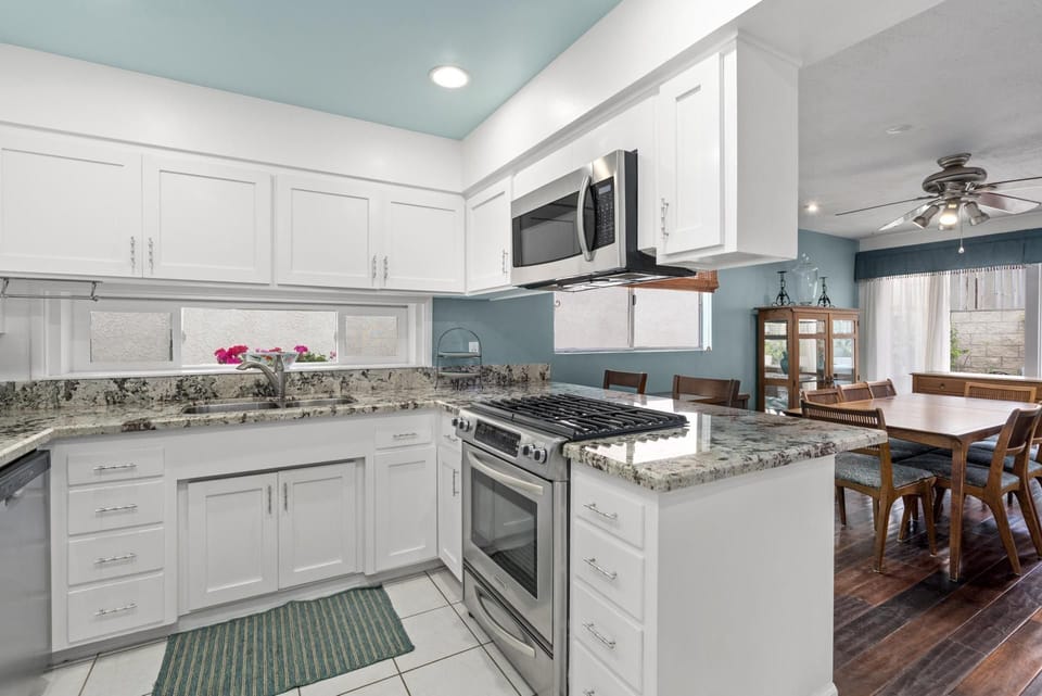 The kitchen comes stocked with dishes, utensils, cookware, bakeware, and all major and small appliances.
                