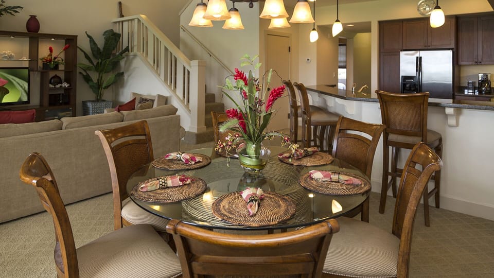 Dining Area with seating by a breakfast counter.