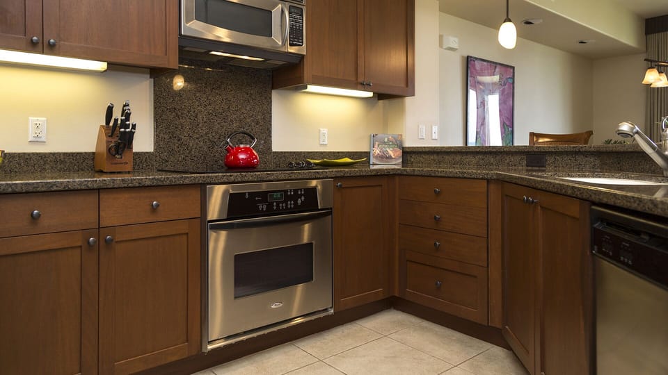 Kitchen with modern amenities, including stainless steel oven range and microwave.