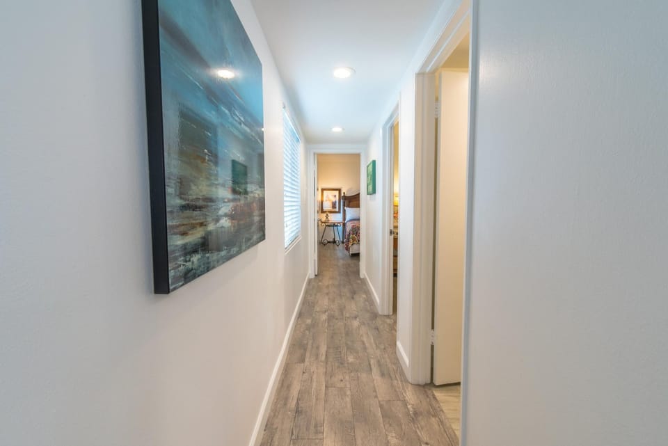 Central hallway leads from the living and kitchen areas to both bedrooms and single bathroom.
                