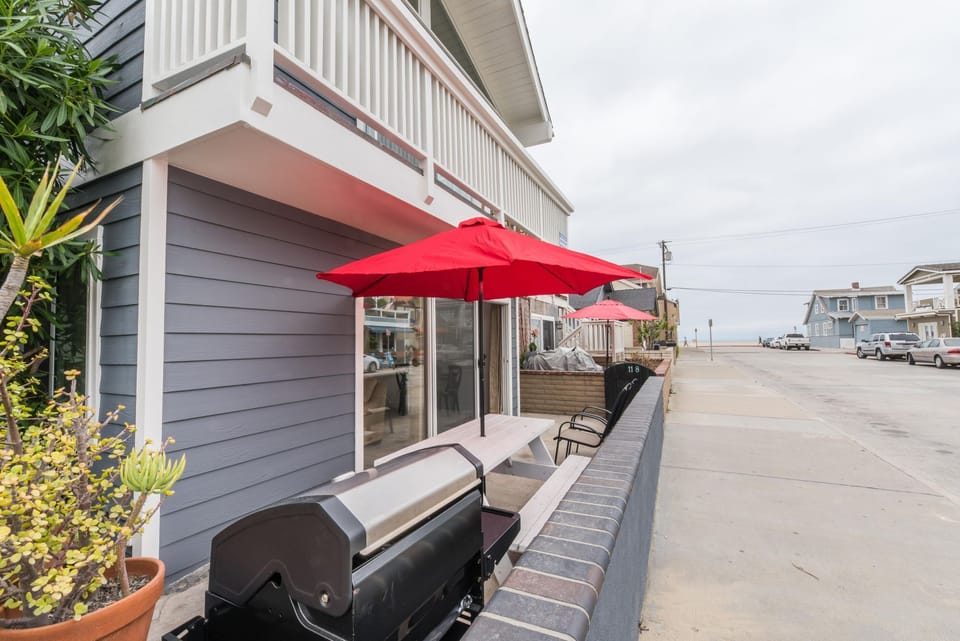 Designated patio table, seating and umbrella for this downstairs unit, along with BBQ grill. Ocean views of the 29th Street beachfront and boardwalk, just a half block away.
                