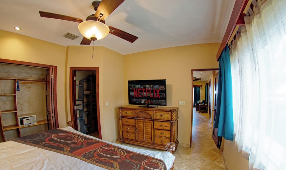 King, lux hardwoods, A/C + ceiling fan, closets, safe, TV, black-out curtains.