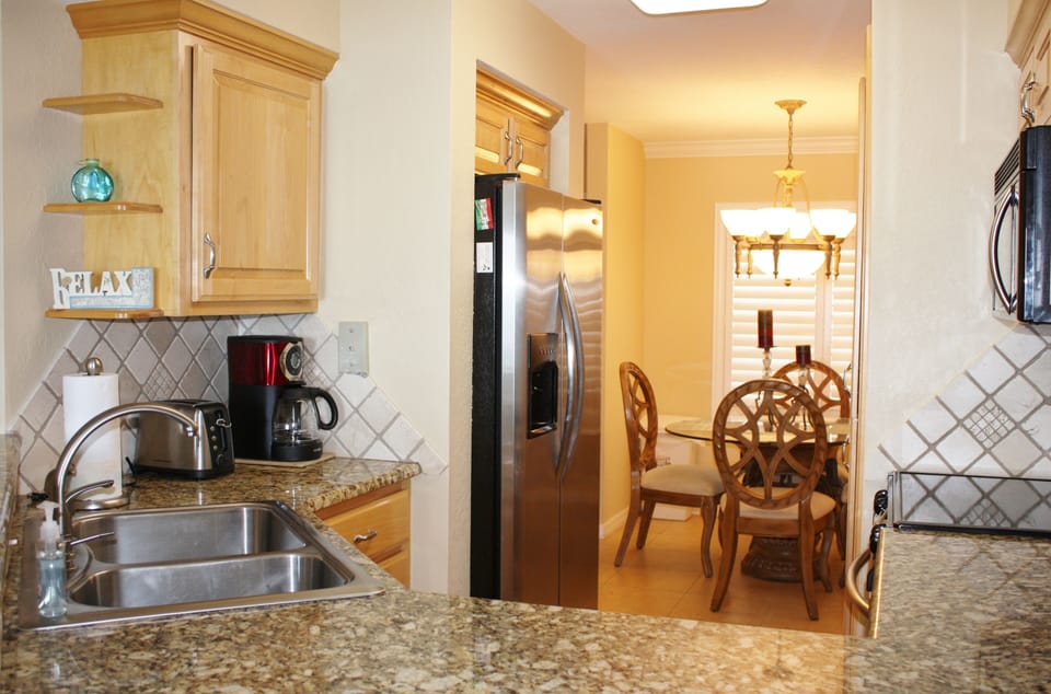 Kitchen opens to dining area