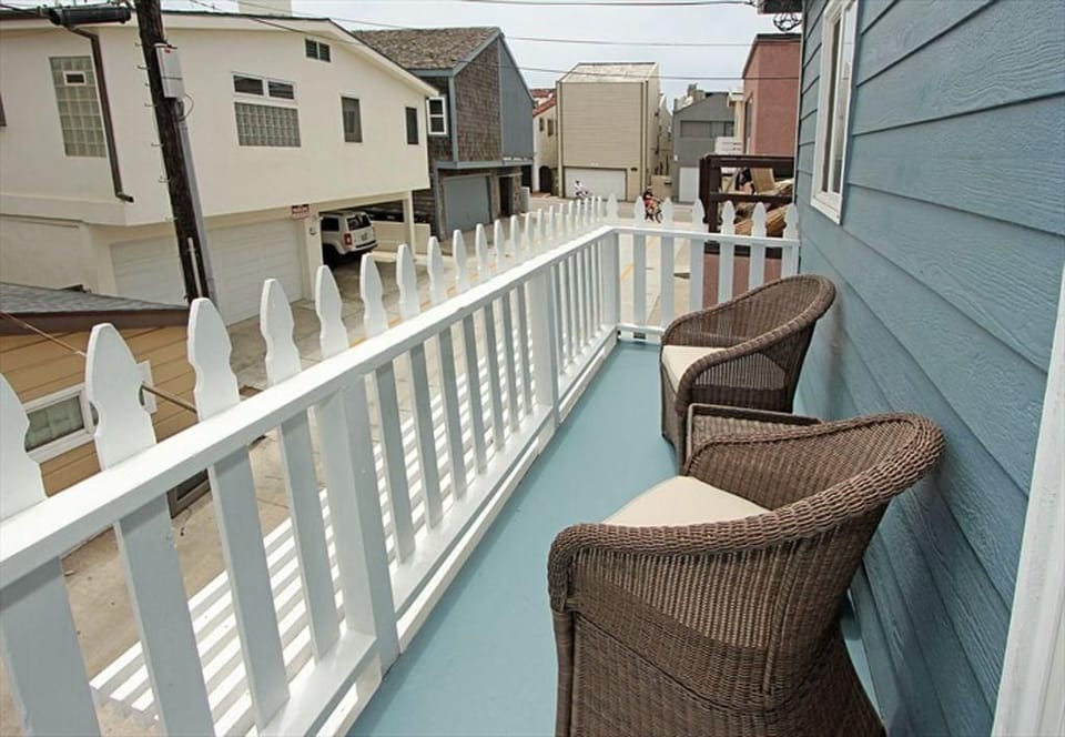 Private rear deck accessed via Bedroom #1 sliding glass door. Morning sun.
                