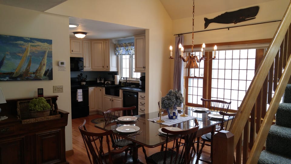 Kitchen is equipped with microwave, dishwasher, stove, fridge with ice and water