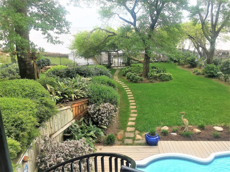 rear yard saltwater pool area and gate to private sound dock & bike/walk path