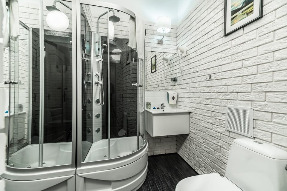 Shower, rainfall showerhead, hair dryer, towels