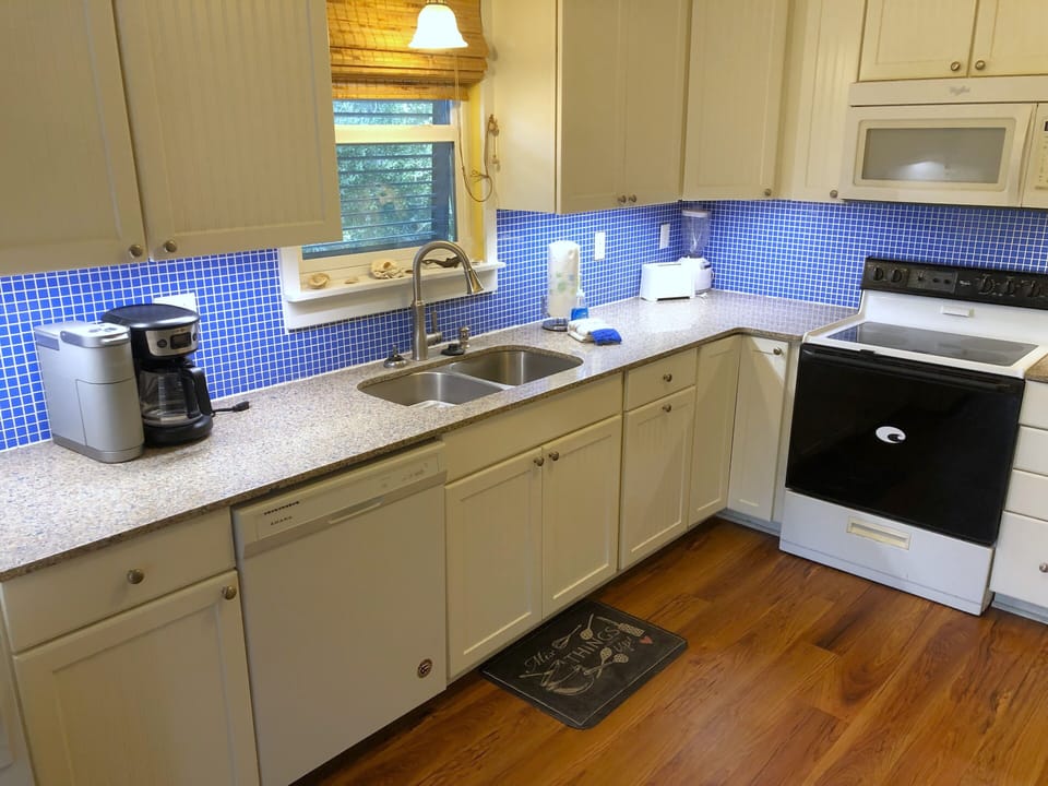 Solid-surface countertops, undermount sink, Keurig AND regular drip, and more! 