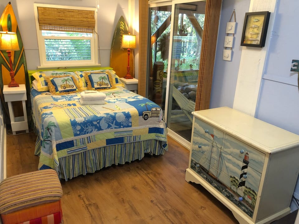 Downstairs bedroom with double bed and private bath. Opens up to screen porch.