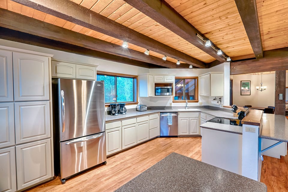 Fully stocked kitchen with plenty of room to prepare meals & serve large groups