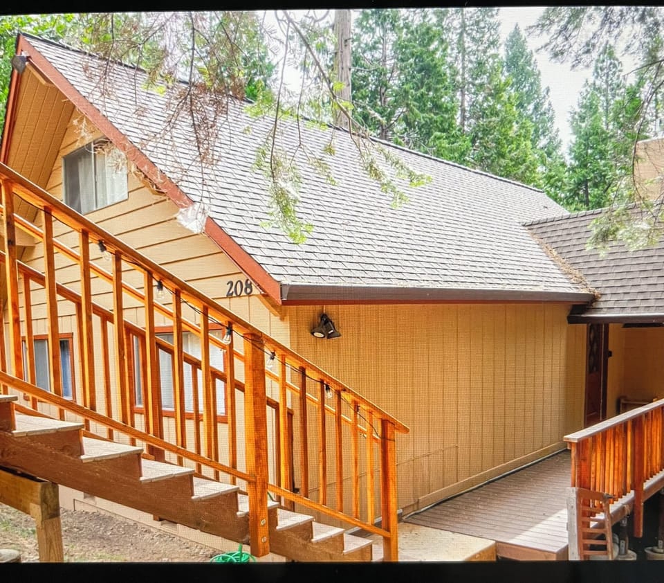 Stairs down from parking pad to front door