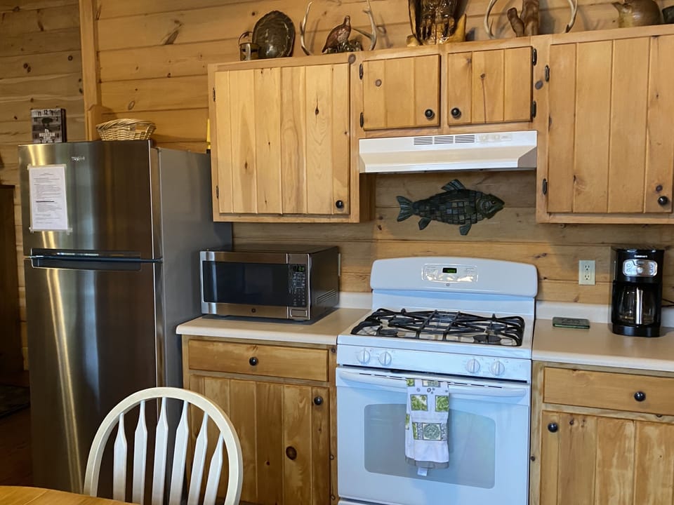 Gas stove and fully furnished kitchen. 